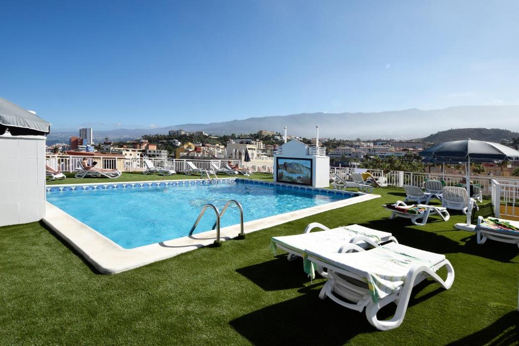 a swimming pool on top of a building at Skyview Hotel Tenerife in Puerto de la Cruz