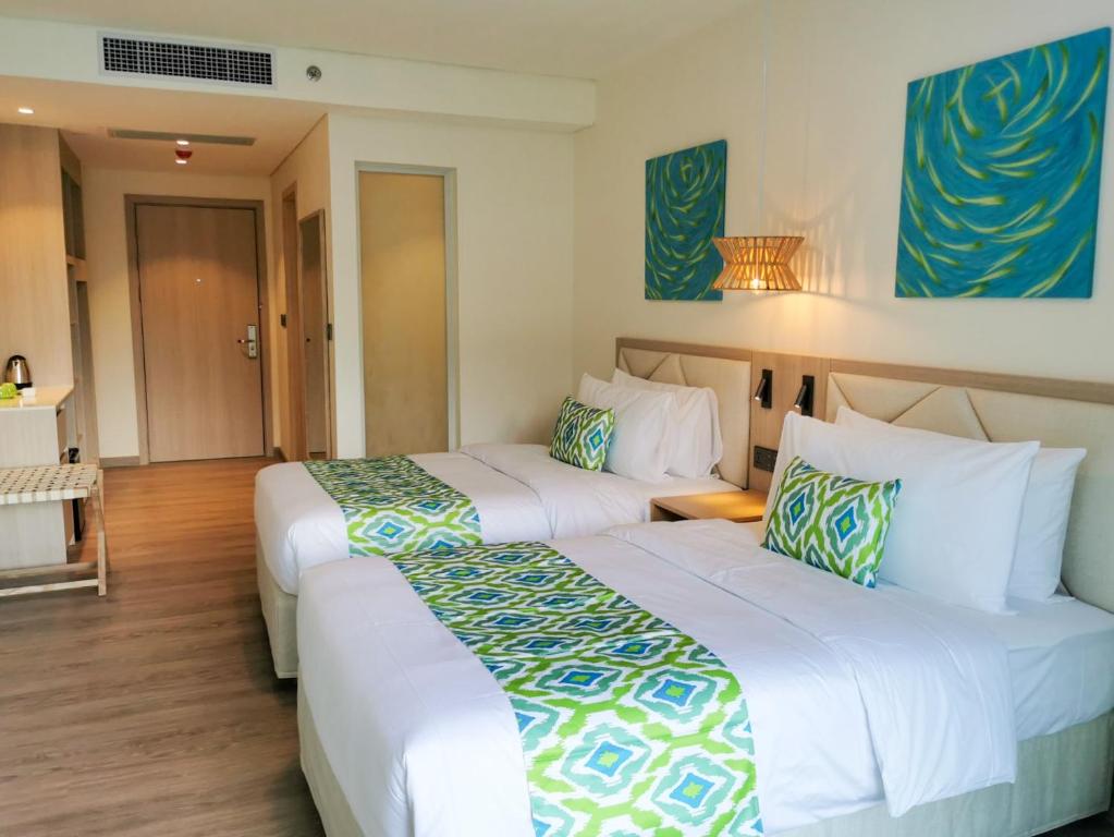 Postel nebo postele na pokoji v ubytování Lime Resort El Nido