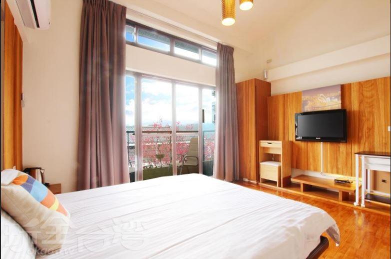 TV a/nebo společenská místnost v ubytování Sanyi Dream Garden B&B