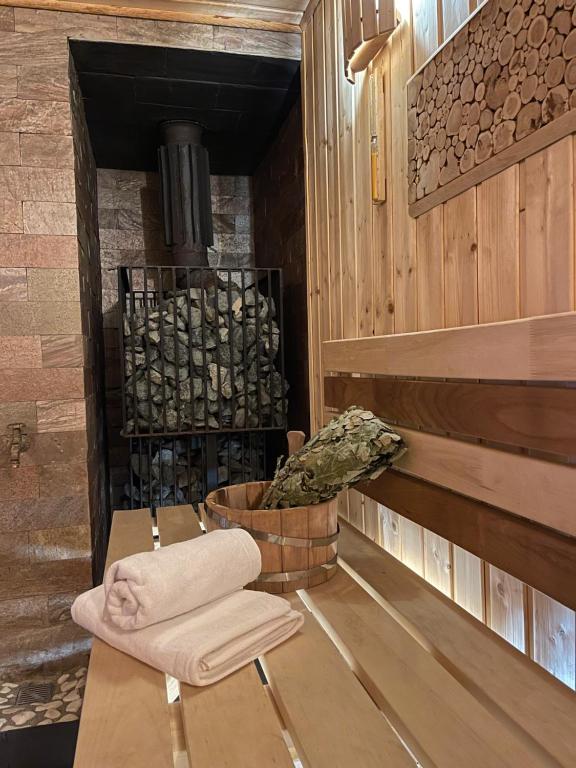 a room with a woodburning stove in a cabin at Domek pod Warszawą z sauną in Raszyn