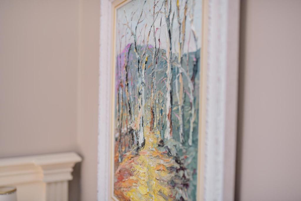 a painting of trees in a painting on a wall at Lot Boutique Hotel by Hotels and Preference in Tirana