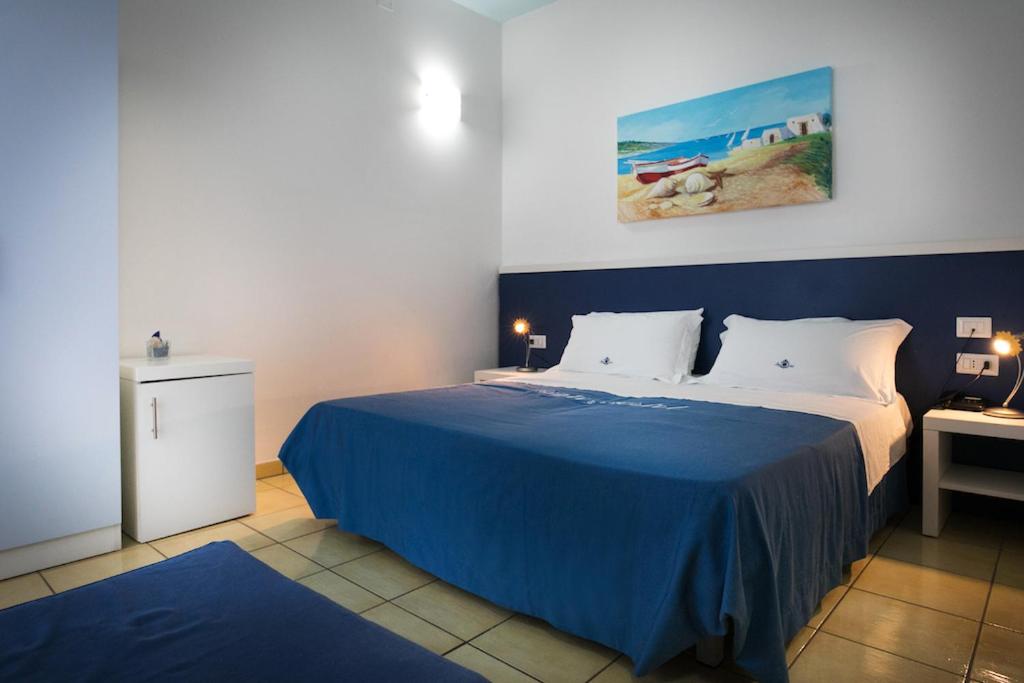 Postel nebo postele na pokoji v ubytování Gigli Hotel Salento