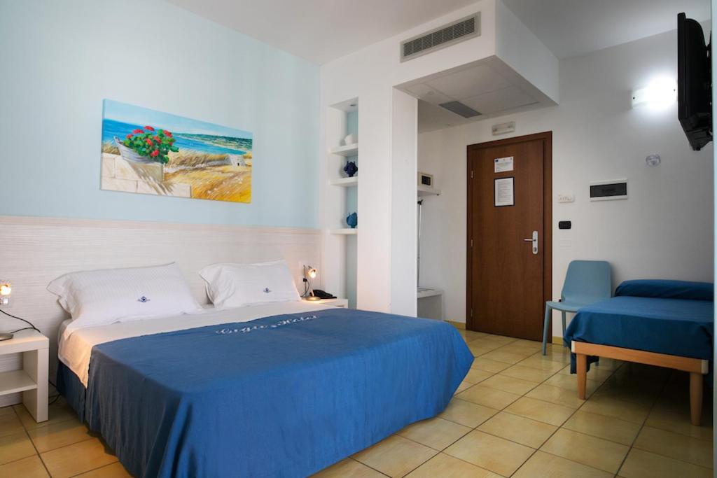 Postel nebo postele na pokoji v ubytování Gigli Hotel Salento