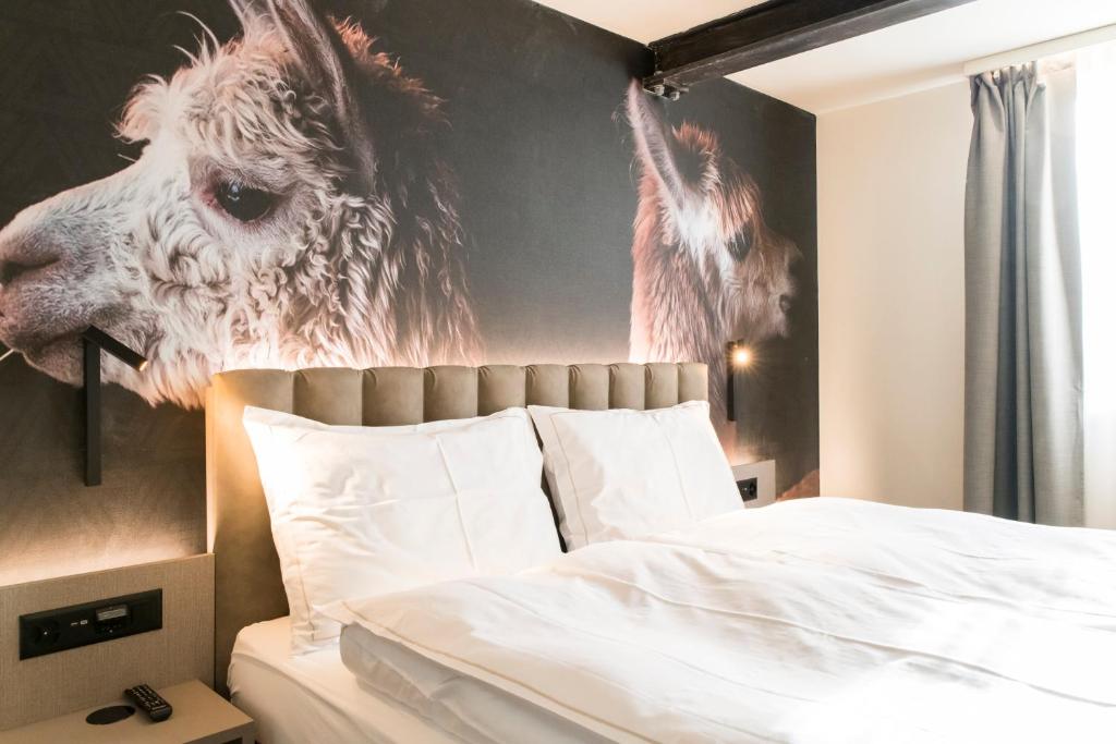 Postel nebo postele na pokoji v ubytování Adaastra Boutique Hotel