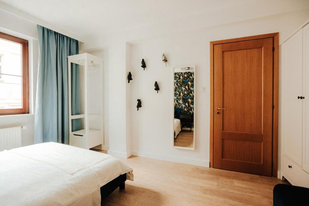 Posteľ alebo postele v izbe v ubytovaní Apartament Rynek Więzienna