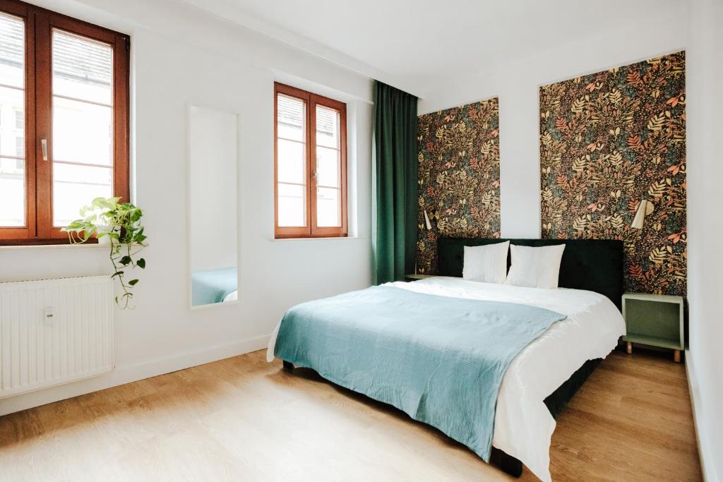 Posteľ alebo postele v izbe v ubytovaní Apartament Rynek Więzienna