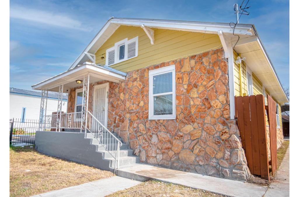 a stone house with a rock wall at Wonderful 3 BR 2 BA Near Downtown in San Antonio