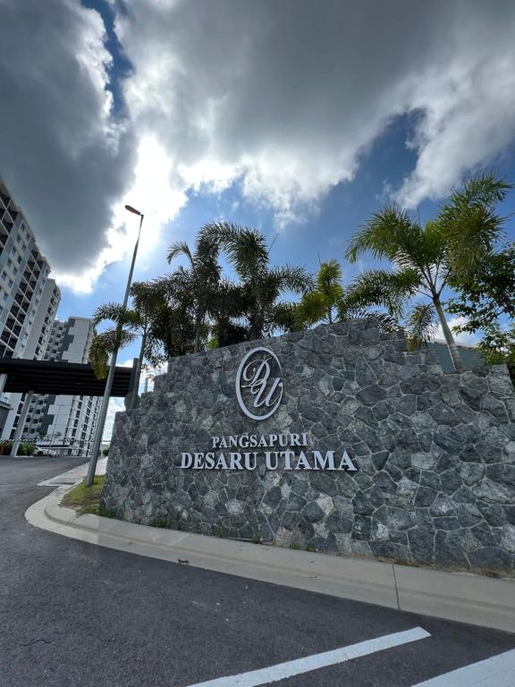 a sign for a disney resort in a city at Desaru Utama Residance Aisy Homestay in Kota Tinggi