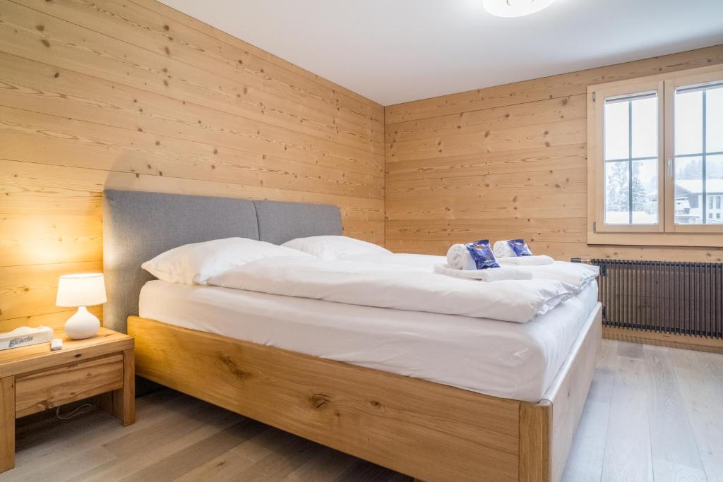 Postel nebo postele na pokoji v ubytování Apartment Ahornisegg - GRIWA RENT AG