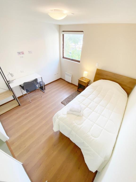 Postel nebo postele na pokoji v ubytování Hostal Buró