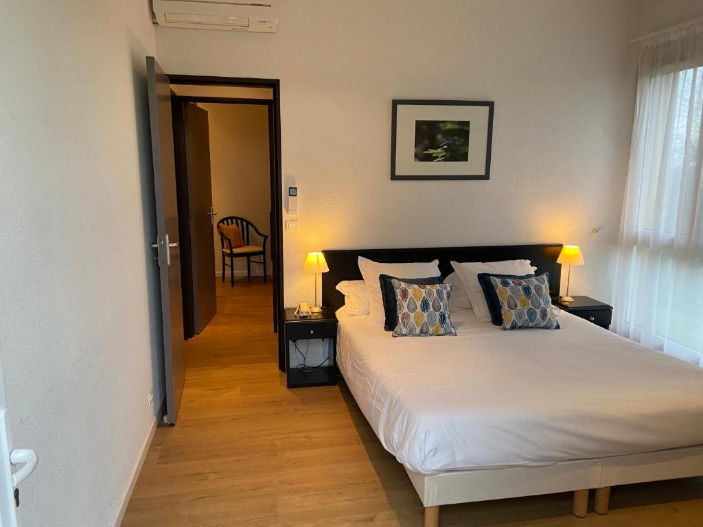 Postel nebo postele na pokoji v ubytování Le Relais de Castelnau