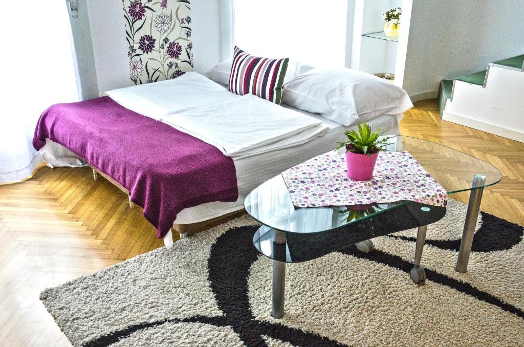 Posteľ alebo postele v izbe v ubytovaní The Fashion Street Apartment