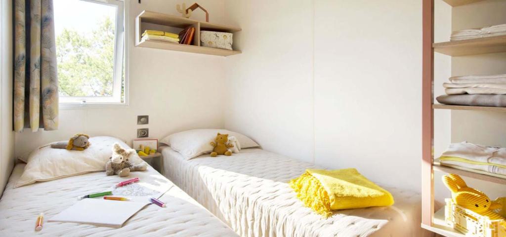 Postel nebo postele na pokoji v ubytování Camping Porto Vecchio