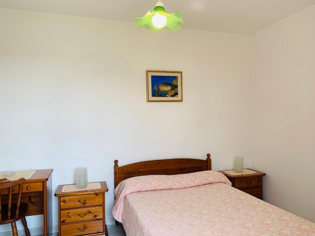 A bed or beds in a room at Pensione Casa Verde