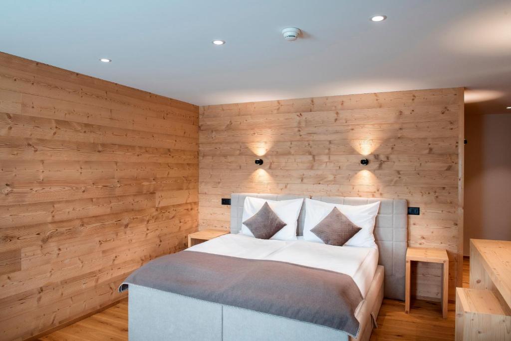 Postel nebo postele na pokoji v ubytování Posthotel Valbella