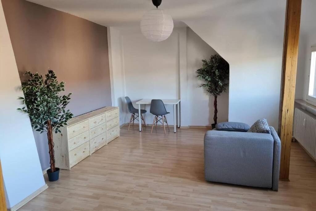 a living room with a couch and a table at L8 Street - Pforzheim Nordstadt in Pforzheim