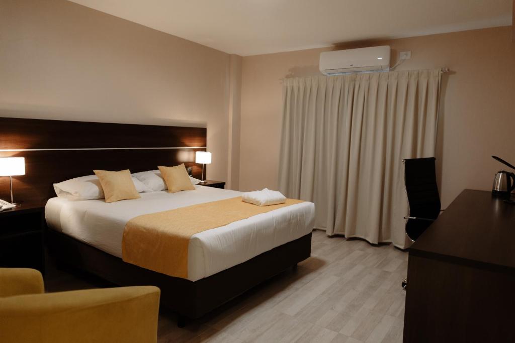 Postel nebo postele na pokoji v ubytování Hotel Batista