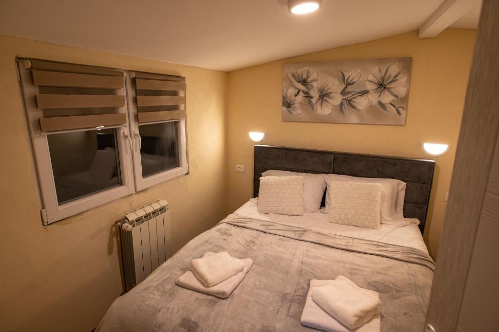 Letto o letti in una camera di Apartmani SP Jovanovic