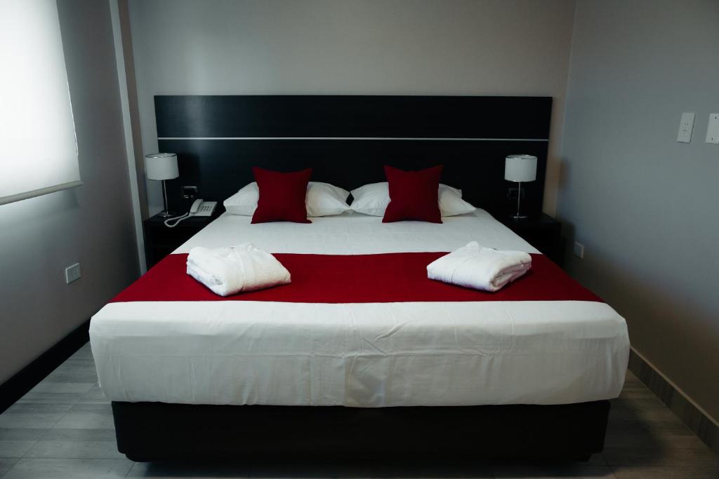 Postel nebo postele na pokoji v ubytování Hotel Batista