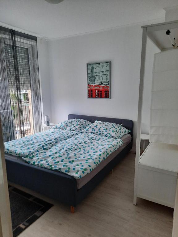 Posteľ alebo postele v izbe v ubytovaní Balatinus Apartmanház