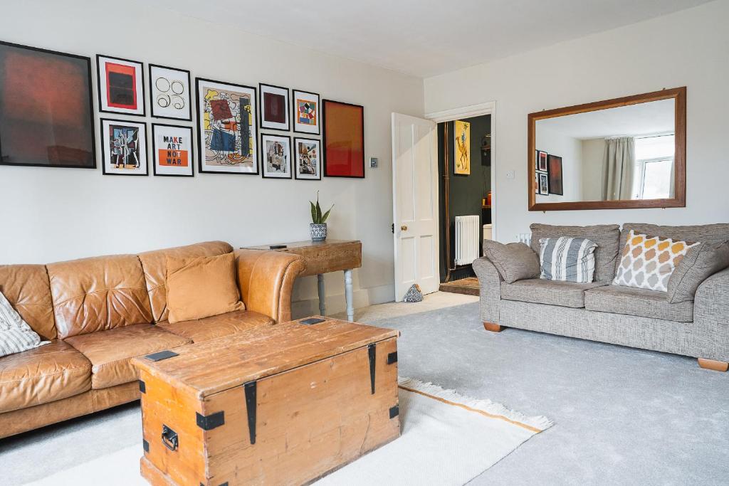 a living room with a couch and a coffee table at The Old Village Shop in Kent