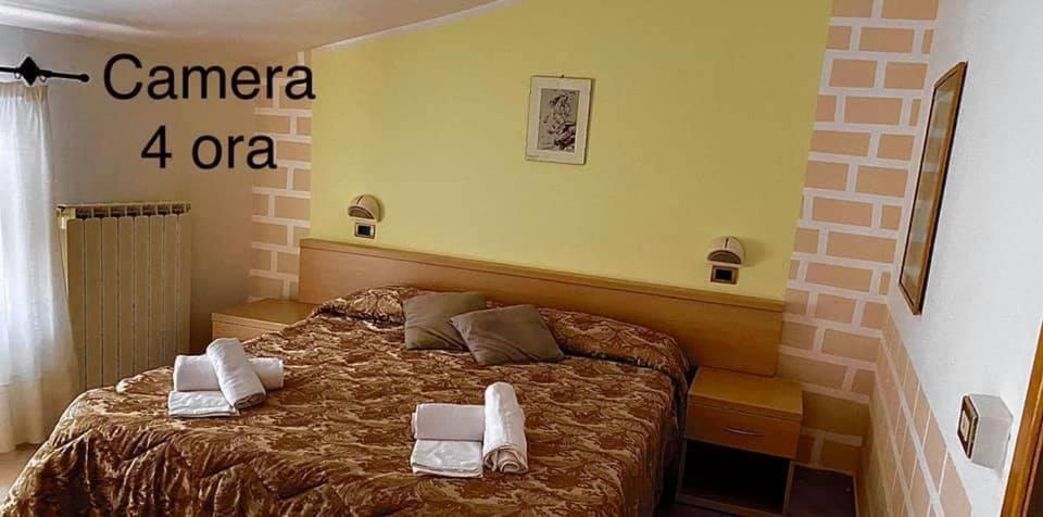 Postel nebo postele na pokoji v ubytování Le Rondini Affittacamere
