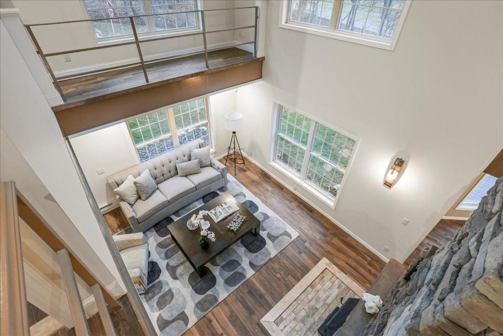 an overhead view of a living room with a couch at Charming 3BR 3Bath In Brilliant Location! in Monroe