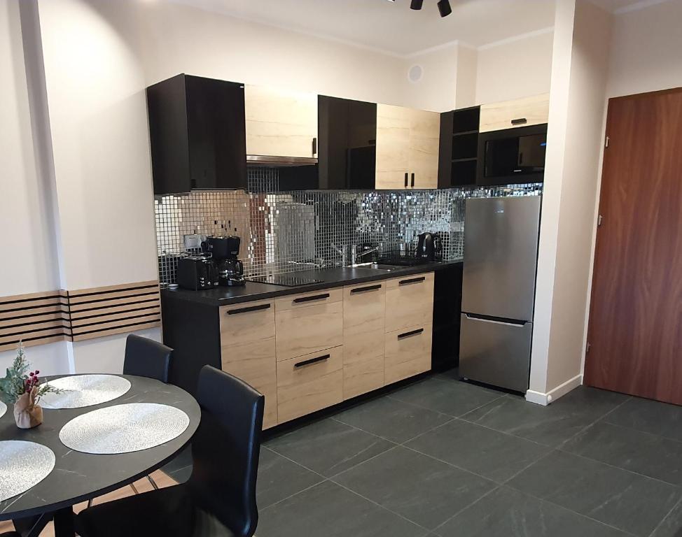 Kuchyňa alebo kuchynka v ubytovaní Karpatia Resort Apartament Krystallos