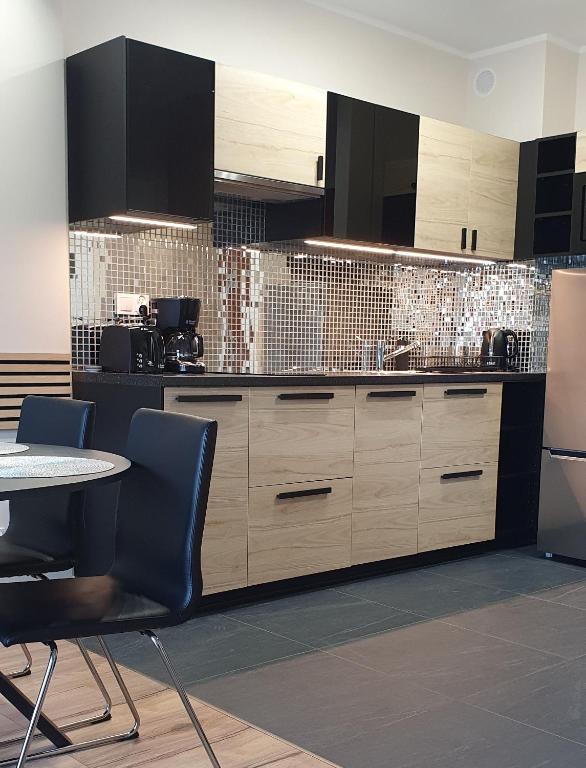 Kuchyňa alebo kuchynka v ubytovaní Karpatia Resort Apartament Krystallos