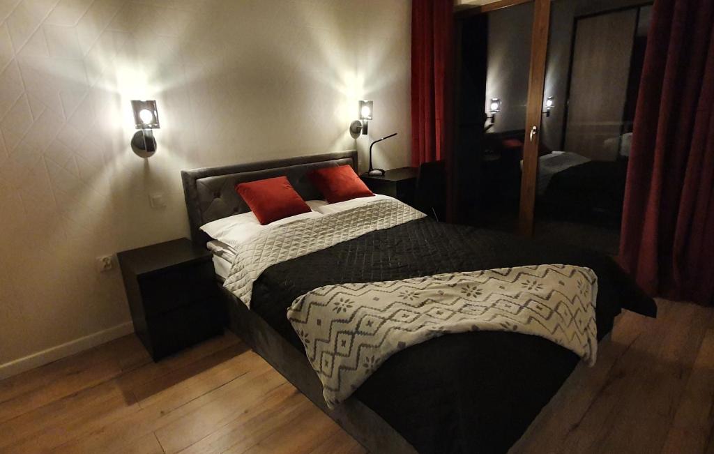 Posteľ alebo postele v izbe v ubytovaní Karpatia Resort Apartament Krystallos