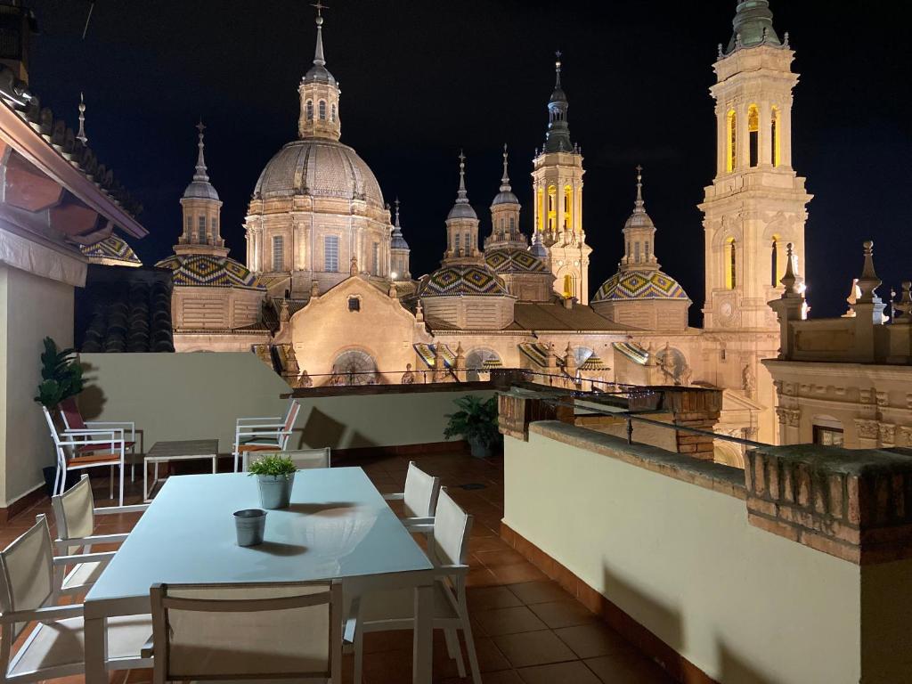 a view of the basilica of india at night at Rooftop Alfonso in Zaragoza