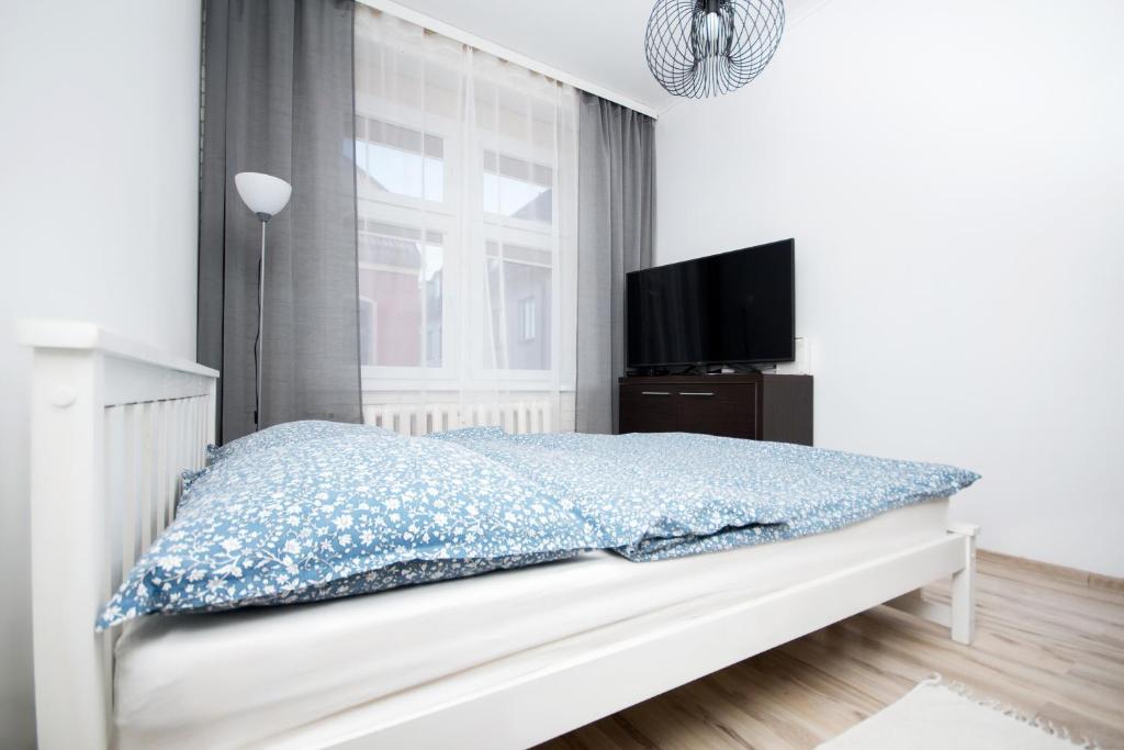 Postel nebo postele na pokoji v ubytování Apartament Marysia Sławno