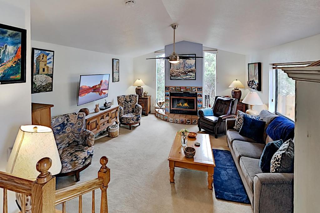 a living room filled with furniture and a fireplace at Casa Azul in Western Sedona in Sedona