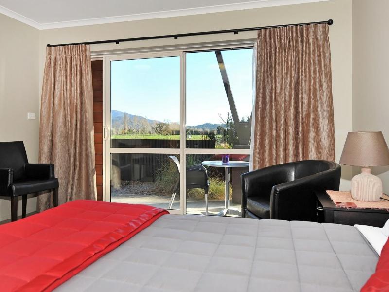 Postel nebo postele na pokoji v ubytování Mohua Motels