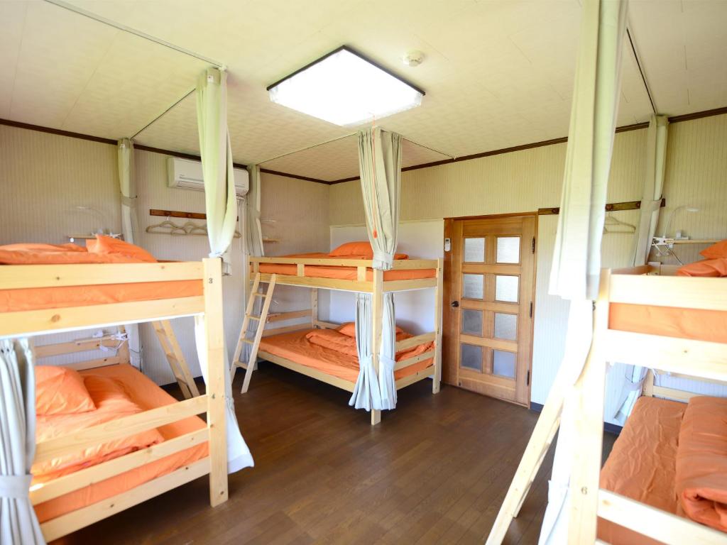 Postel nebo postele na pokoji v ubytování Haruno Guesthouse