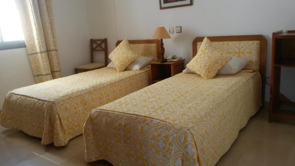 Postel nebo postele na pokoji v ubytování Hotel Zelis
