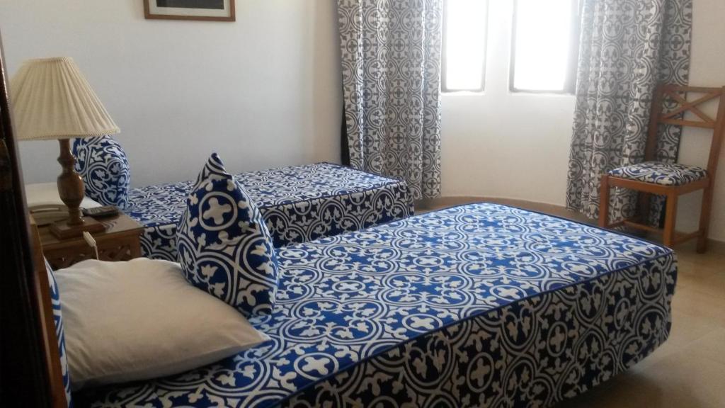 Postel nebo postele na pokoji v ubytování Hotel Zelis