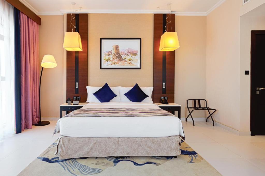 Postel nebo postele na pokoji v ubytování TIME Asma Hotel