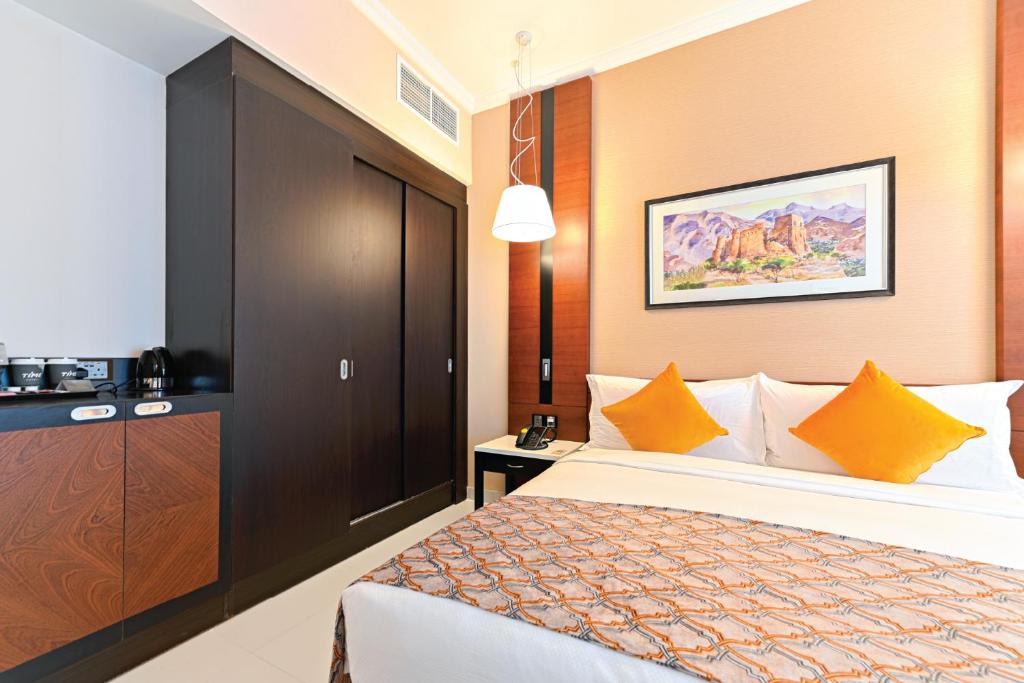 Postel nebo postele na pokoji v ubytování TIME Asma Hotel