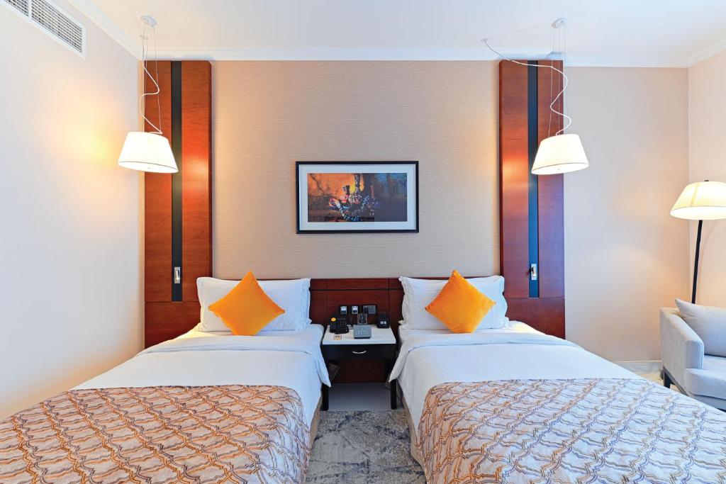 Postel nebo postele na pokoji v ubytování TIME Asma Hotel