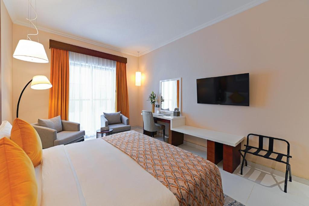 TV a/nebo společenská místnost v ubytování TIME Asma Hotel