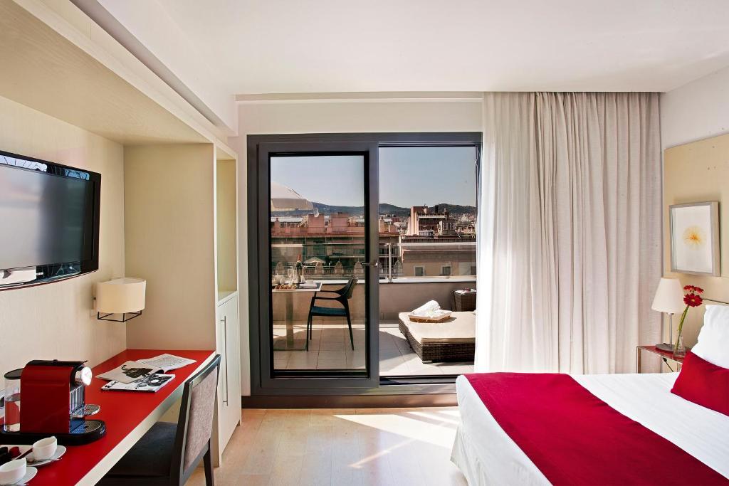 Postel nebo postele na pokoji v ubytování Grupotel Gran Via 678