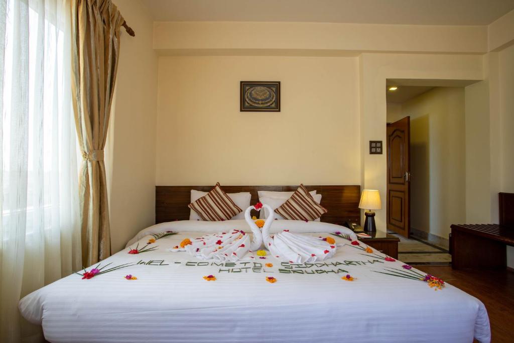 Postel nebo postele na pokoji v ubytování Siddhartha Boutique Hotel, Boudha