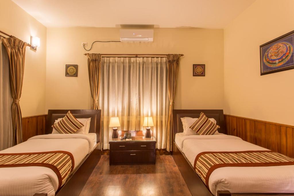 Postel nebo postele na pokoji v ubytování Siddhartha Boutique Hotel, Boudha