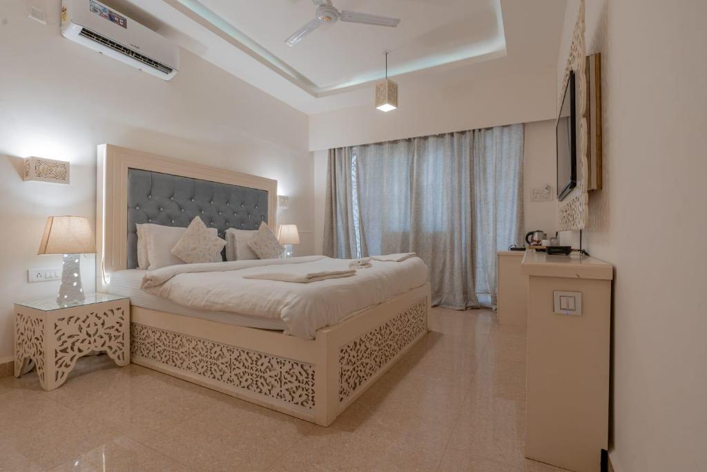 Postel nebo postele na pokoji v ubytování Lillywoods Zac Beach Resort, Calangute