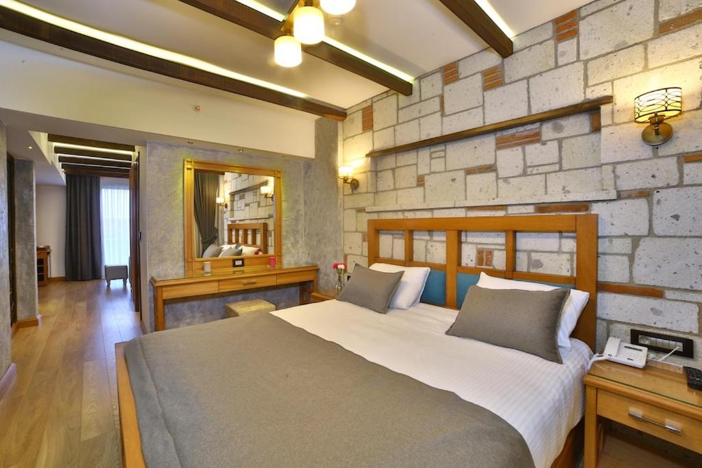 A bed or beds in a room at Yılsam Sultanahmet Hotel