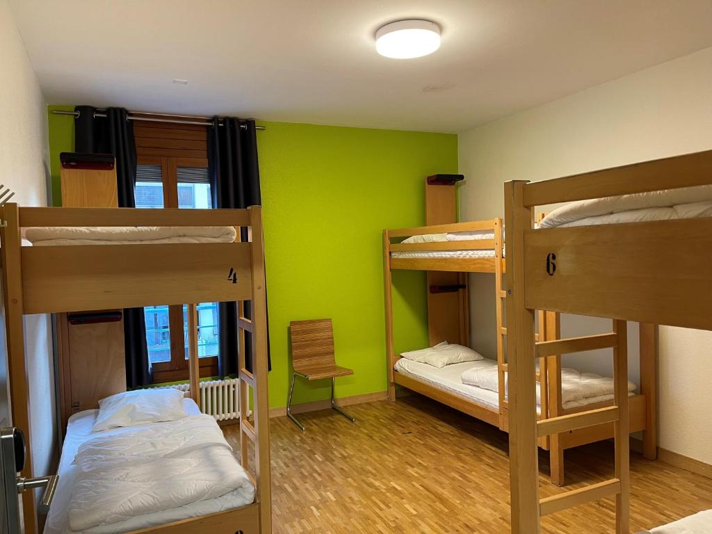 Postel nebo postele na pokoji v ubytování Geneva Hostel