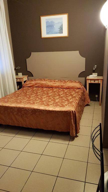 Postel nebo postele na pokoji v ubytování Hotel Ariston