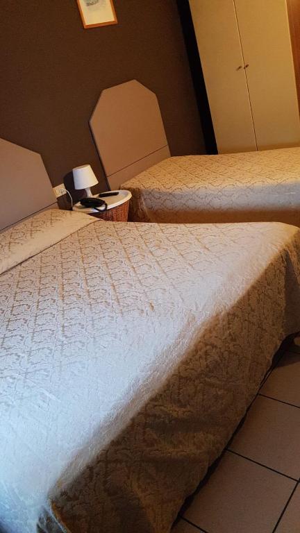 Postel nebo postele na pokoji v ubytování Hotel Ariston