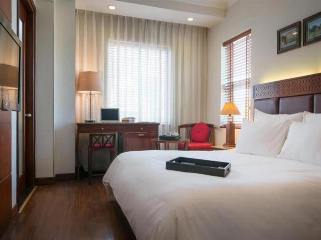 Postel nebo postele na pokoji v ubytování Hanoi E Central Luxury Hotel & Restaurant